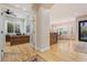 Inviting foyer with hardwood floors leads to office space and dining area with plentiful natural light at 9566 E Raindance Trl, Scottsdale, AZ 85262