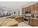 Open concept kitchen featuring a granite countertop, stainless steel appliances, and ample cabinet space at 9566 E Raindance Trl, Scottsdale, AZ 85262