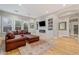 Spacious living room with built-in bookshelves, fireplace, and natural light at 9566 E Raindance Trl, Scottsdale, AZ 85262