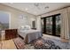 Serene main bedroom with private access to the backyard patio at 9566 E Raindance Trl, Scottsdale, AZ 85262