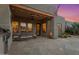 Outdoor patio with BBQ, seating area, and view of desert landscaping at 9566 E Raindance Trl, Scottsdale, AZ 85262
