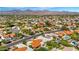 Aerial view of a residential neighborhood with desert landscaping, swimming pools, and mountain views in the background at 9849 E Topaz Dr, Scottsdale, AZ 85258