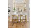 Chic bar seating area with stylish stools, decorative lighting, and a charming display shelf at 9849 E Topaz Dr, Scottsdale, AZ 85258