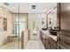 Elegant bathroom with dual vanities, a glass-enclosed shower, and tile accents at 9849 E Topaz Dr, Scottsdale, AZ 85258