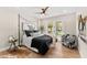 This bedroom has a ceiling fan and a door to the backyard at 9849 E Topaz Dr, Scottsdale, AZ 85258