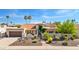 Charming home features a tile roof, desert landscaping, and gated front entrance at 9849 E Topaz Dr, Scottsdale, AZ 85258