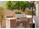Outdoor kitchen featuring a built-in grill and prep area for outdoor cooking at 9849 E Topaz Dr, Scottsdale, AZ 85258