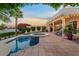 Backyard featuring a pool, spa, and beautifully landscaped yard at 1700 E Lakeside Dr # 12, Gilbert, AZ 85234