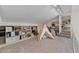 Carpeted bonus room featuring built in shelves and a view to the home's staircase and entrance at 1700 E Lakeside Dr # 12, Gilbert, AZ 85234