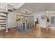 Cozy dining area featuring a modern chandelier, spiral staircase, and hardwood floors at 1700 E Lakeside Dr # 12, Gilbert, AZ 85234