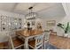 Bright dining room with wood table, decor art and modern chandelier at 1700 E Lakeside Dr # 12, Gilbert, AZ 85234