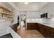 Stylish, updated kitchen with stainless appliances, wood floors and open shelves at 1700 E Lakeside Dr # 12, Gilbert, AZ 85234