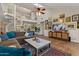 Elegant living room featuring a spiral staircase, high ceilings, and stylish decor at 1700 E Lakeside Dr # 12, Gilbert, AZ 85234
