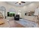 A well lit office space with a comfortable chair and a large carpet on hardwood floors at 1700 E Lakeside Dr # 12, Gilbert, AZ 85234