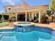 Inviting pool and spa with tile accents, surrounded by lounge chairs and covered patio at 1700 E Lakeside Dr # 12, Gilbert, AZ 85234