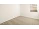 Bright bedroom features neutral carpet, fresh paint, and window for natural light at 17425 W Eva St, Waddell, AZ 85355