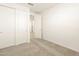 Bedroom featuring carpet, walk in closet and fresh paint at 17425 W Eva St, Waddell, AZ 85355