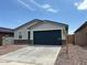 Charming single-story home features a two-car garage and low maintenance front yard at 17425 W Eva St, Waddell, AZ 85355