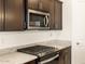 Modern kitchen features stainless steel appliances and granite countertops at 17425 W Eva St, Waddell, AZ 85355