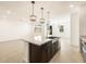 Spacious kitchen features an island with a sink and stainless steel appliances at 17425 W Eva St, Waddell, AZ 85355