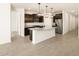 Modern kitchen with stainless steel appliances, large island and stylish pendant lighting at 17425 W Eva St, Waddell, AZ 85355