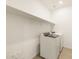 Functional laundry room featuring modern appliances, extra storage and light colored walls at 17425 W Eva St, Waddell, AZ 85355