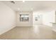 Spacious living area with ample natural light and modern light fixtures at 17425 W Eva St, Waddell, AZ 85355