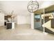 Open concept living space with sleek flooring, seamlessly connecting kitchen and patio at 17425 W Eva St, Waddell, AZ 85355