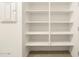 Pantry with adjustable shelving, ample storage space and light colored walls at 17425 W Eva St, Waddell, AZ 85355