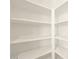 Bright pantry closet with white shelving for optimal storage at 17425 W Eva St, Waddell, AZ 85355