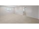 Spacious bedroom featuring neutral carpet, window, and walk-in closet at 17782 W Getty Dr, Goodyear, AZ 85338