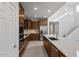 Bright kitchen boasts stainless steel appliances, ample cabinet space, and an island with a sink at 17782 W Getty Dr, Goodyear, AZ 85338