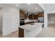 Modern kitchen featuring a large center island, stainless steel appliances, and ample counter space at 17782 W Getty Dr, Goodyear, AZ 85338
