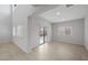 Bright, open living room with large windows and sliding glass doors leading to the backyard at 17782 W Getty Dr, Goodyear, AZ 85338