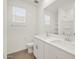 Bathroom featuring double sinks, a large mirror, and ample counter space at 37341 W San Clemente St, Maricopa, AZ 85138