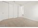Clean and bright bedroom featuring a closet, carpet, and natural light at 37341 W San Clemente St, Maricopa, AZ 85138