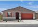 Inviting single-story home featuring a well-maintained front yard and a two-car garage at 37341 W San Clemente St, Maricopa, AZ 85138