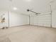 Spacious two-car garage with overhead door and tankless water heater at 37341 W San Clemente St, Maricopa, AZ 85138