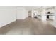 Open concept living space features tile flooring, recessed lighting, and easy access to the kitchen at 37341 W San Clemente St, Maricopa, AZ 85138