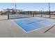 Outdoor pickleball court perfect for recreational play and neighborhood activities at 37341 W San Clemente St, Maricopa, AZ 85138