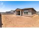 Spacious backyard featuring dirt landscaping and block wall perimeter at 37373 W San Clemente St, Maricopa, AZ 85138