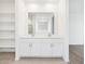 Bright bathroom featuring double vanity with modern fixtures and plenty of storage at 37373 W San Clemente St, Maricopa, AZ 85138
