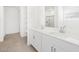 Bright bathroom features a shower and a double sink vanity at 37373 W San Clemente St, Maricopa, AZ 85138