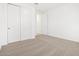 Spacious bedroom featuring a closet with sliding doors, neutral carpet, and fresh white walls at 37373 W San Clemente St, Maricopa, AZ 85138
