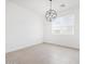 Bright dining area with contemporary chandelier and tiled floors, perfect for gatherings at 37373 W San Clemente St, Maricopa, AZ 85138