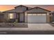 Charming single-story home with a two-car garage, desert landscaping, and a covered front porch at 37373 W San Clemente St, Maricopa, AZ 85138