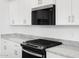 Close up of a kitchen with stainless appliances and granite countertops at 37373 W San Clemente St, Maricopa, AZ 85138