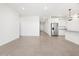 Bright and open living space featuring tile flooring, kitchen and an open layout at 37373 W San Clemente St, Maricopa, AZ 85138