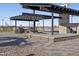 Outdoor community kitchen featuring BBQ grills, and a covered patio area, perfect for gatherings at 37373 W San Clemente St, Maricopa, AZ 85138