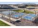 Community pickleball courts with blue surface and surrounding fencing at 37373 W San Clemente St, Maricopa, AZ 85138